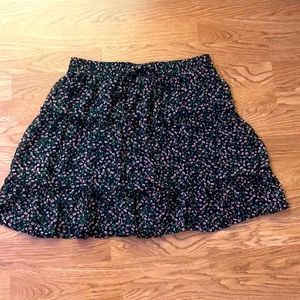 Mini skirt, black floral, 16in long, tiered, elastic waistband.